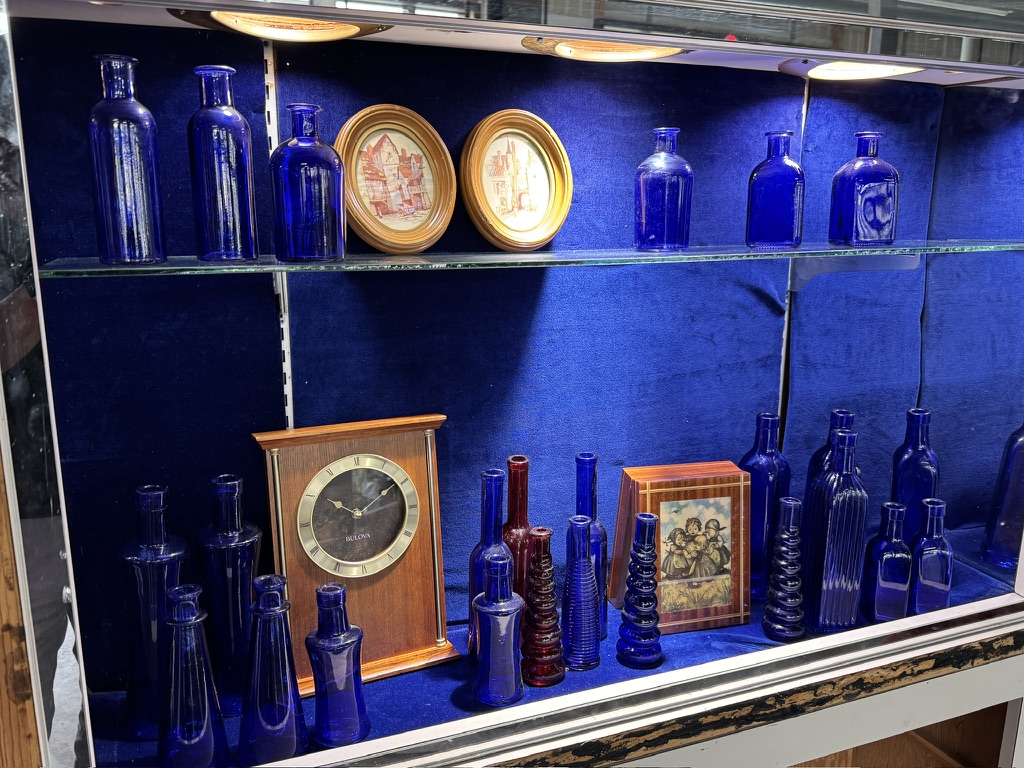 Cobalt glass, framed pictures, and a vintage clock