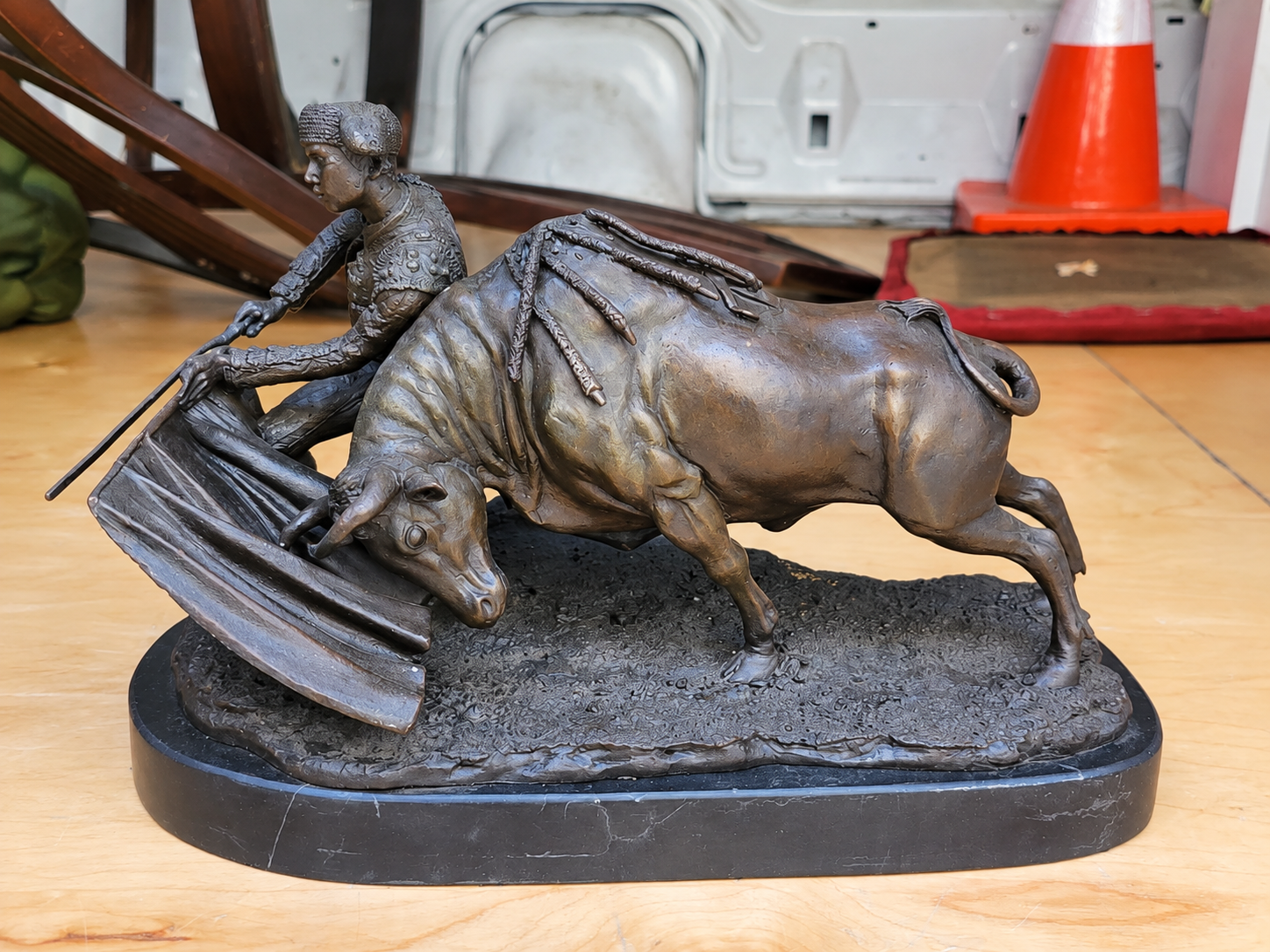 A bronze bull and matador sculpture