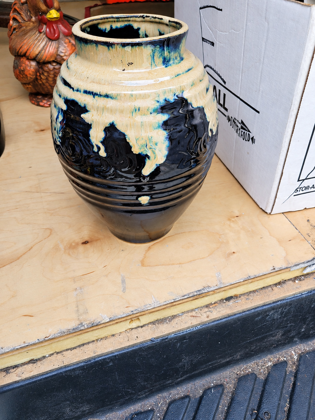 A glazed blue and cream ceramic vase