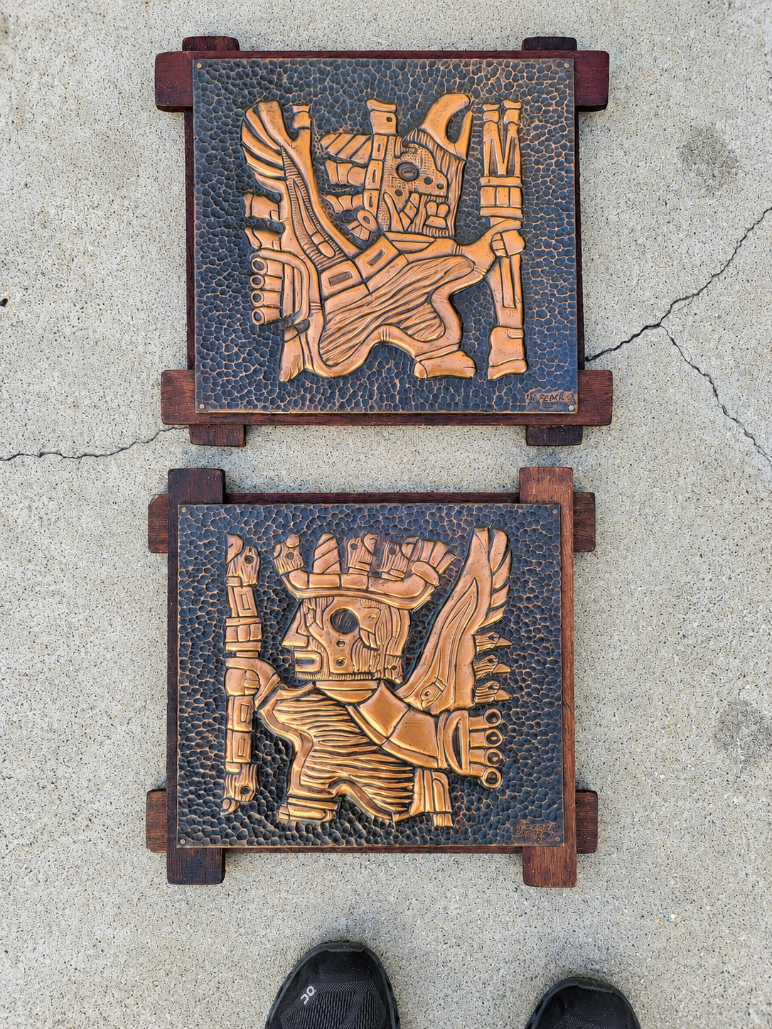Two framed copper relief artworks