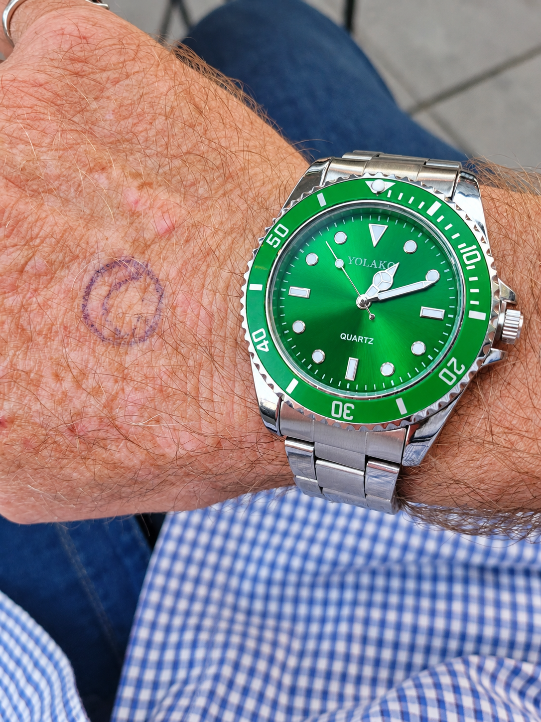 A bright green vintage-style wristwatch