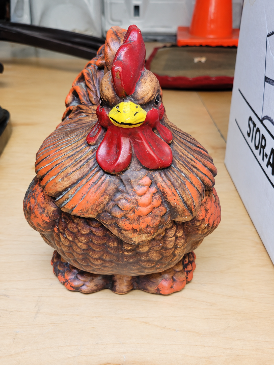 A cheerful painted rooster figure