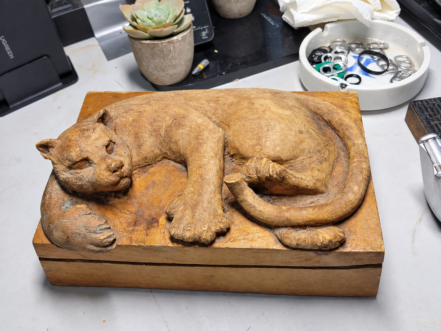 A carved wooden cat keepsake box