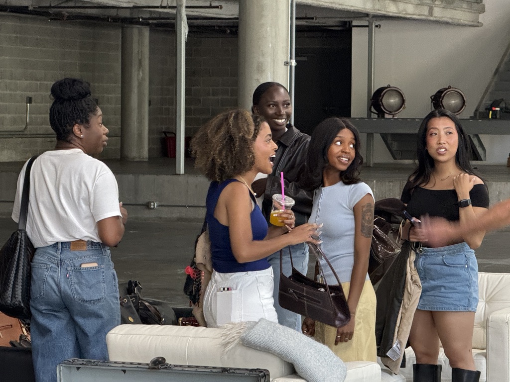 Friends sharing a moment at a past Jive market