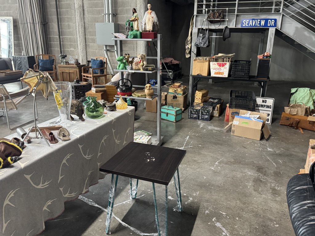 An eclectic market display of furniture and collectibles
