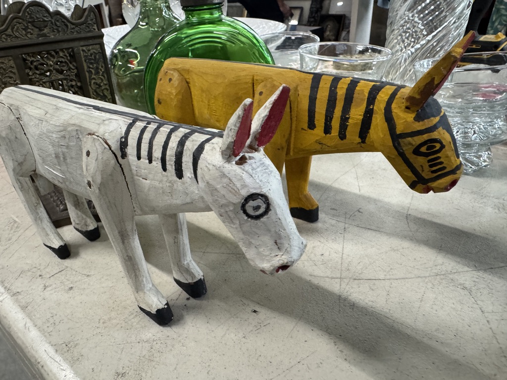 Two painted wooden animal figures